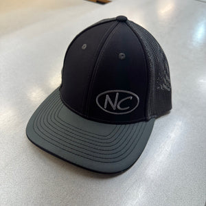 BLACK/GREY CURVED BILL PACIFIC HEADWEAR FITTED TRUCKER HAT WITH GREY NC OVAL LOGO