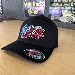 BLACK CURVED BILL FLEX FIT HAT WITH AMERICAN FLAG TATTOO SCRIPT LEFT PANEL