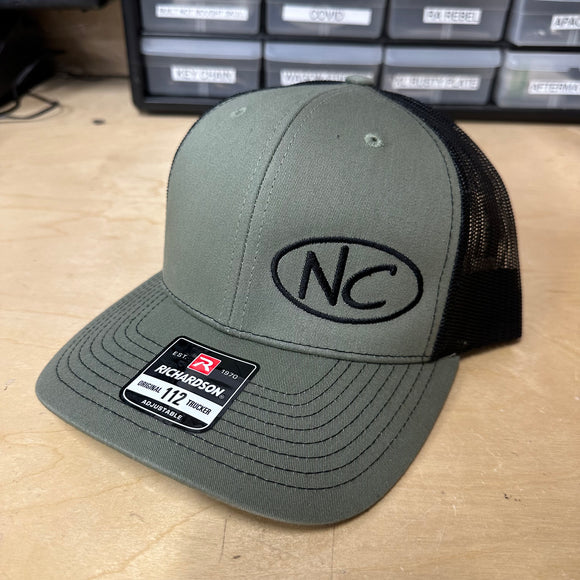 NEGATIVE CAMBER CURVED BILL SNAP BACK HAT WITH BLACK NC OVAL LOGO ON LODEN/BLACK