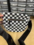 Black and white checkered cross body bag, with logo stitching
