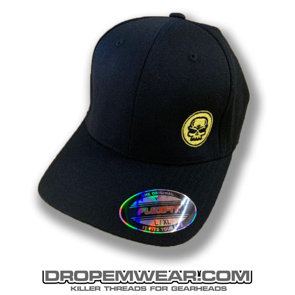 BLACK CURVED BILL FLEX FIT HAT WITH YELLOW SKULL LOGO